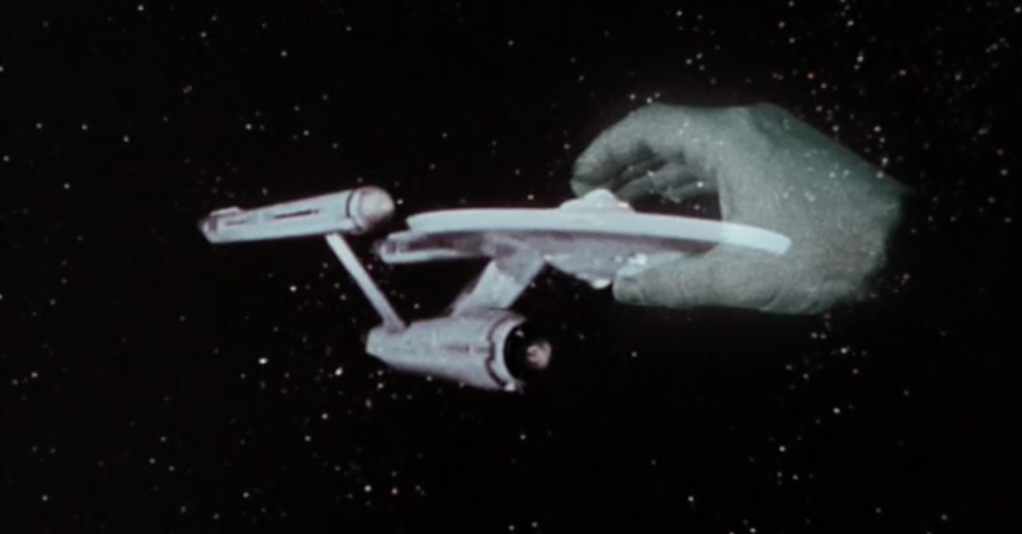 Giant space hand grabbing the starship Enterprise from an episode of Star Trek